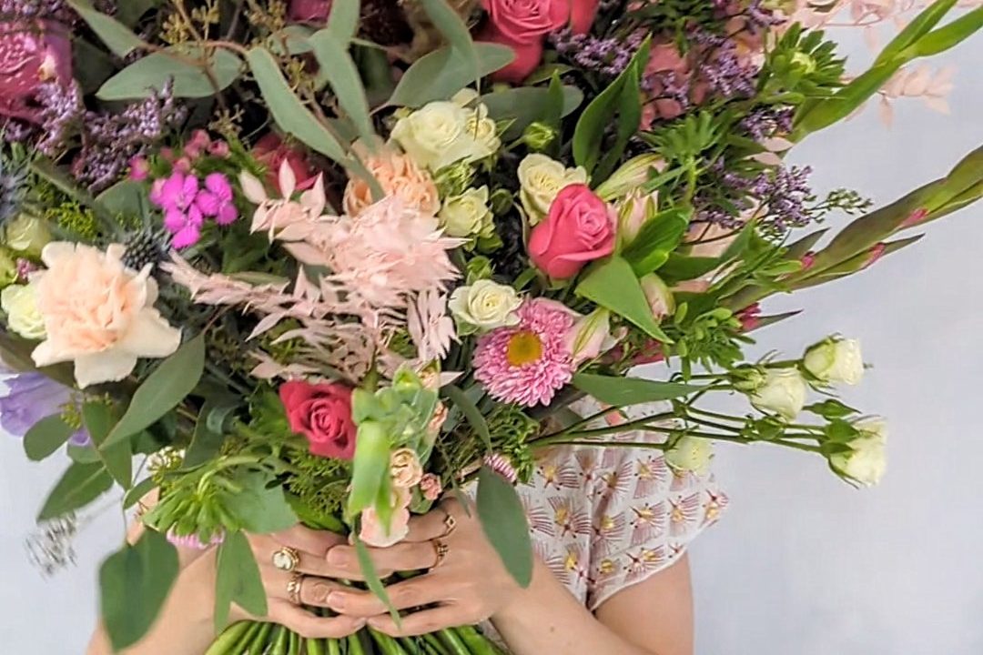 Luxurious domed and structured bouquet containing scented lilac garden roses, pale blue hydrangeas and complimenting pastel flowers. Beautifully arranged and hand tied. 